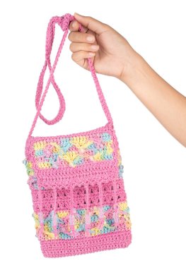 hand holding Crochet knitting bag isolated on white background