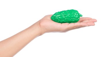 hand holding plastic toy gourd isolated on white background