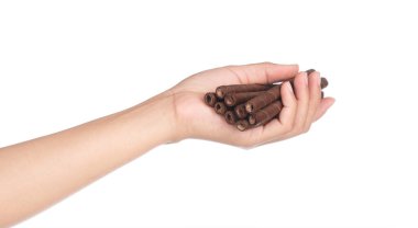hand holding Chocolate wafer sticks isolated on white background