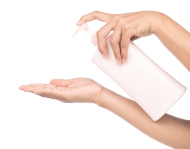 hand holding lotion isolated on white background