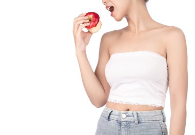 young woman wearing white strapless dress and jeans bite red app