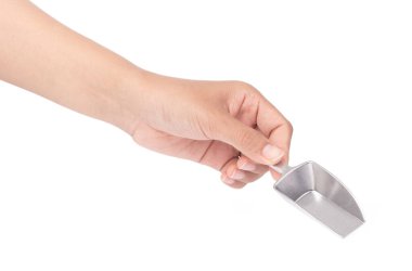 hand holding silver scoop isolated on white background