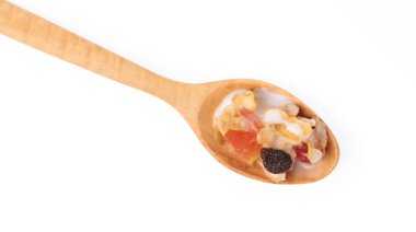 Cereal on wood spoon isolated on white background.