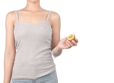 woman in grey tank top and jeans holding kiwi isolated on white 