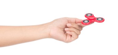 fingers playing a red fidget spinner isolated on a white backgro