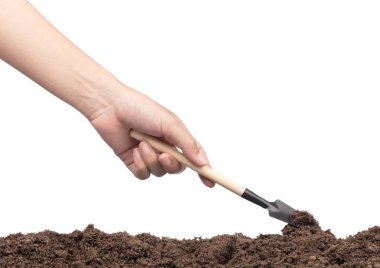 hand digging soil by shovel isolated on white background