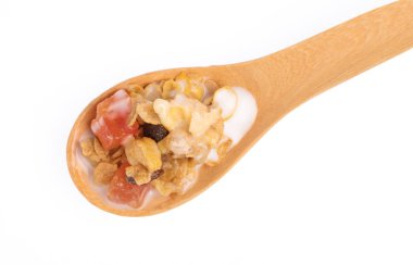 Cereal on wood spoon isolated on white background.