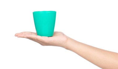 hand holding a green plastic glass isolated on a white backgroun