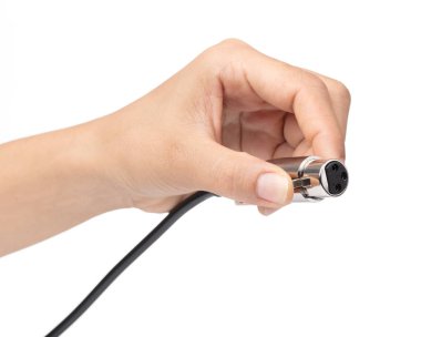 hand holding Connector for audio equipment isolated on white bac