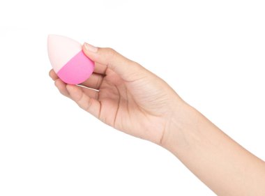 hand holding Pink egg beauty sponge isolated on a white backgrou