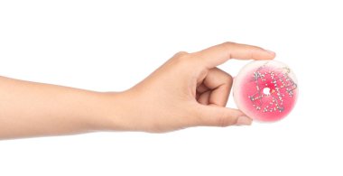 hand holding a Donut with colorful sprinkles isolated on white b
