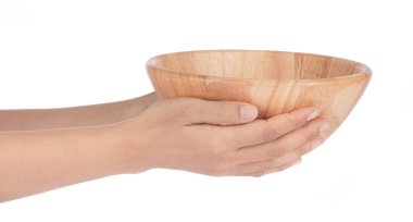 Hand holding Wood bowl isolated on white background
