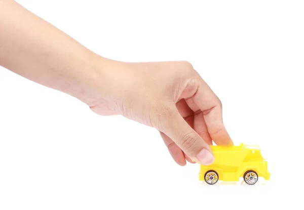 Hand hält Spielzeug Müllwagen isoliert auf weißem Hintergrund — Stockfoto