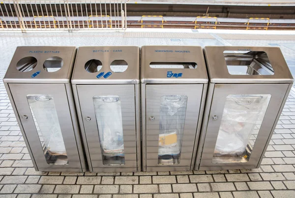 Garbage separation bins in train station — Stock Photo, Image