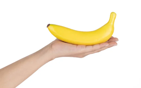 Hand håller Banana för dekoration konstgjorda frukt prydnader ar — Stockfoto