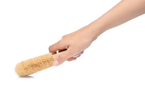 Hand holding Wooden body bath brush isolated on white background — Stockfoto