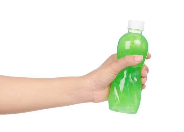 Hand holding kiwi juice in bottle isolated on white background — Stok fotoğraf