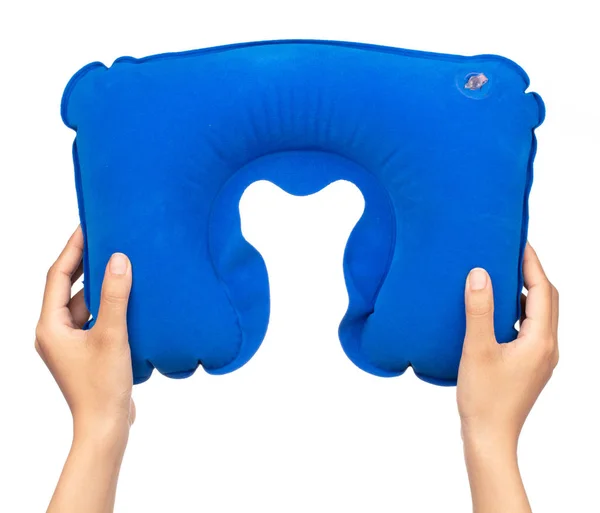 Hand holding Blue neck pillow isolated on a white background — 图库照片