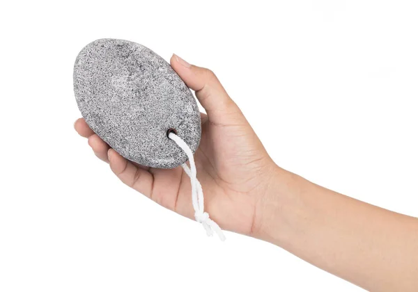 Ручной держания пемзы камень для очистки и ухода за телом изолированы на — стоковое фото