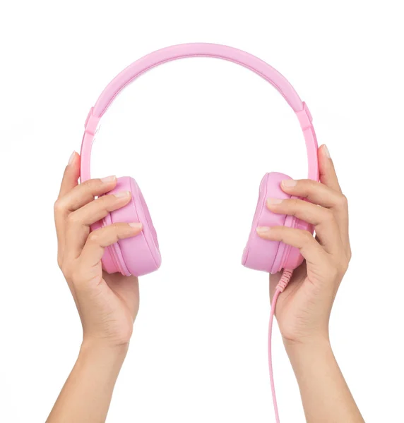 Mão segurando fones de ouvido rosa isolados no fundo branco — Fotografia de Stock