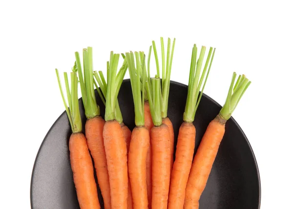 Fresh baby carrots on dish isolated on white background — Stock Photo, Image