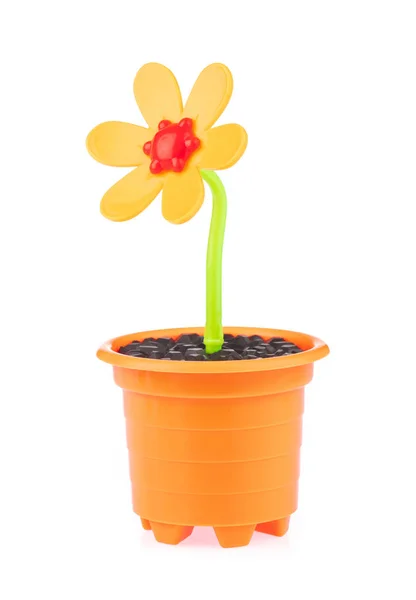 Beautiful plastic flowers in a flower pot isolated on a white ba — ストック写真