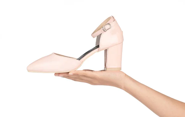 Hand holding Beige female strap heels leather stiletto shoes iso — Stock Photo, Image