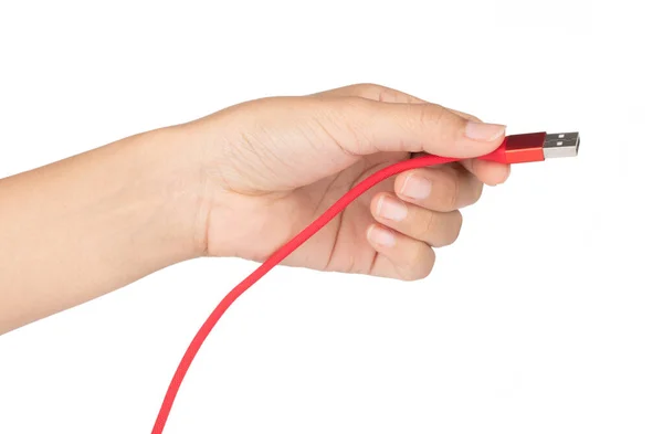 Hand holding Red USB cable for smartphone isolated on white back — Stockfoto