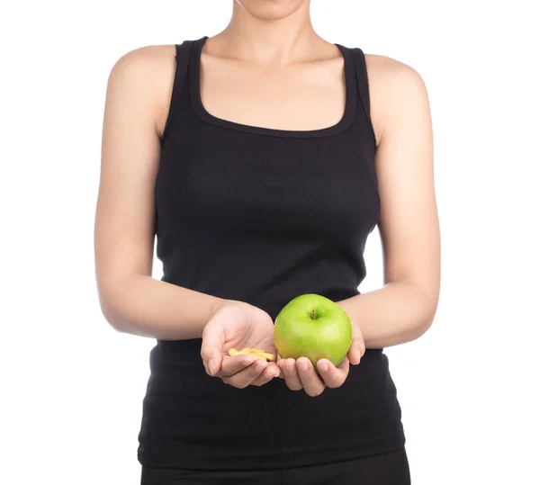 Young slim woman holding green apple. Isolated on white backgrou Royalty Free Stock Images
