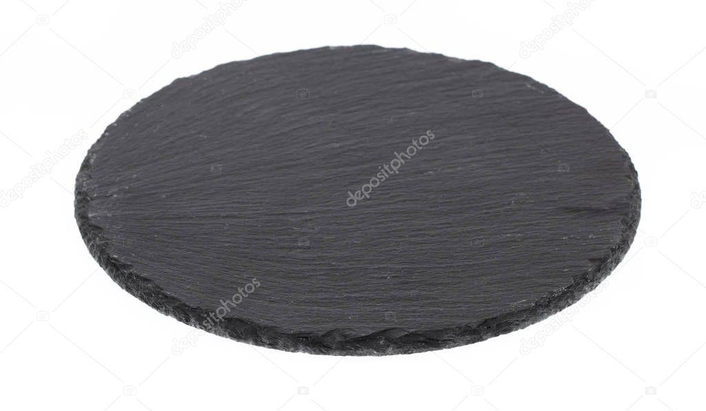 Black round stone plate isolated on white background