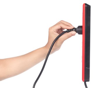 hand puts electrical plug socket isolated on white background