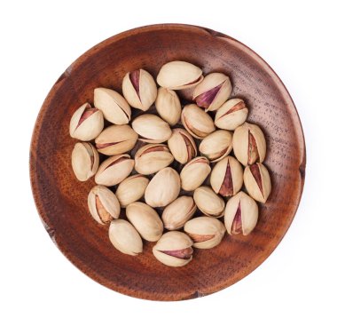 dish of Pistachio nuts. Isolated on a white background