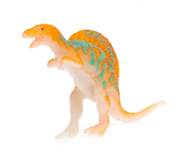 Спинозавр сделан из пластика. Игрушка динозавра, изолированная на белом — стоковое фото
