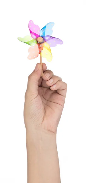 Hand holding colorful pinwheel isolated on white background — Stock Photo, Image