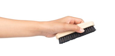 Beyaz arka planda el ele tutuşan ayakkabı fırçaları beyaz arkaplanda izole edilmiş