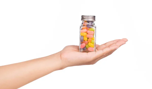 Hand Holding Jelly Bean Candies Glass Bottle Isolated White Background — Stock Photo, Image