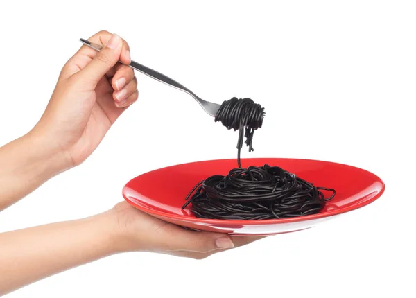 Hand Houden Roll Zwarte Pasta Spaghetti Met Een Vork Geïsoleerd — Stockfoto
