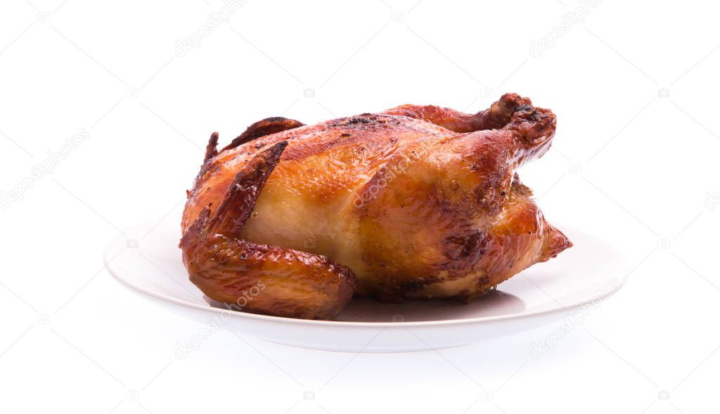 Roasted chicken on plate isolated on white background