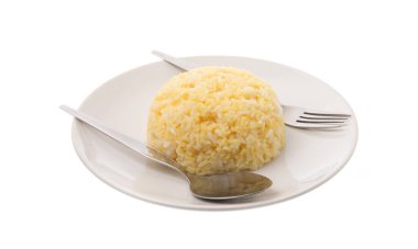 rice in a plate / a portion of cooked yellow rice in white ceramic dish