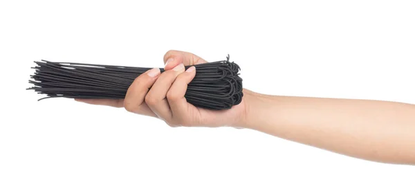 Hand Holding Uncooked Black Spaghetti Isolated White Background — Stock Photo, Image