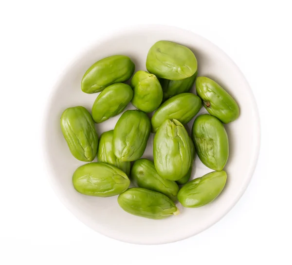 Groene Misleidende Zaden Plaat Geïsoleerd Witte Achtergrond — Stockfoto