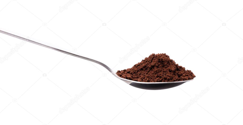 coffee powder on spoon isolated on white background