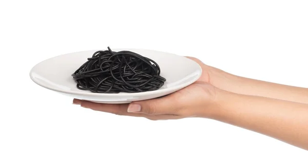 Mão Segurando Espaguete Preto Prato Isolado Fundo Branco — Fotografia de Stock