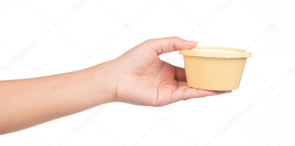 hand holding Plastic circle container for dairy foods Isolated on a white background