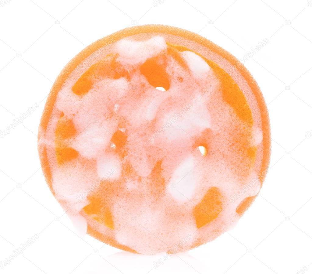 Orange sponge wet with foam isolated on white background.