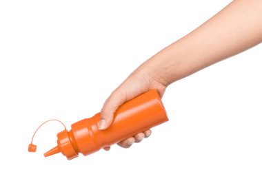 hand holding a bottle of Chilli sauce isolated on white background