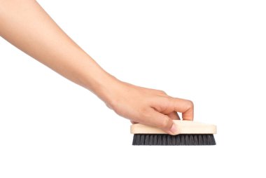 Beyaz arka planda el ele tutuşan ayakkabı fırçaları beyaz arkaplanda izole edilmiş