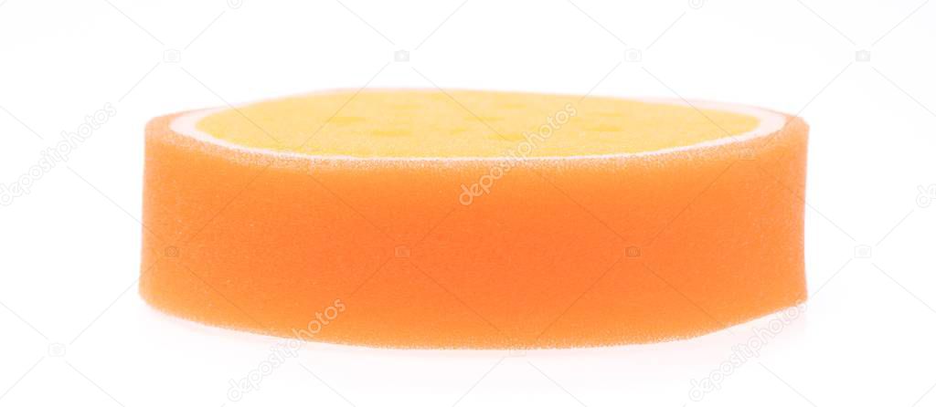 Orange sponge isolated on white background.
