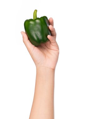 Yeşil biber beyaz arka plan üzerinde izole tutan el