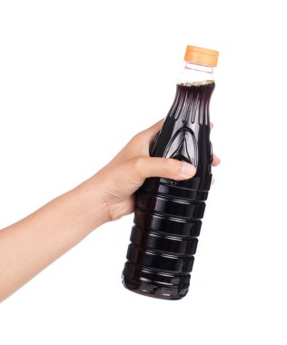 hand holding Soy Sauce bottle isolated on white background.